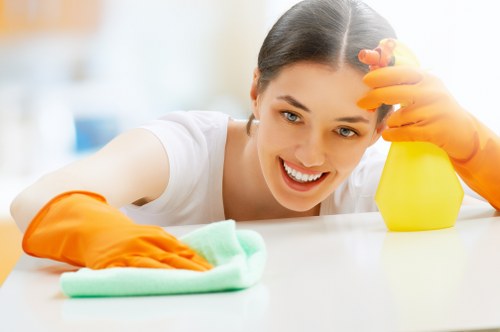 Low-moisture carpet cleaning method in a family space